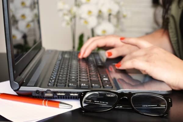 person woman desk laptop 1