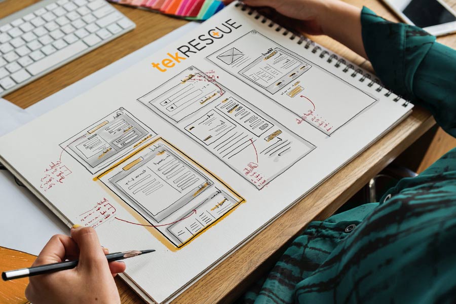 A mobile-first web design mockup drawn on paper