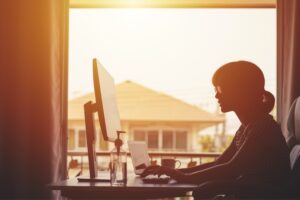 a woman browsing the web securely as she manages her small business.