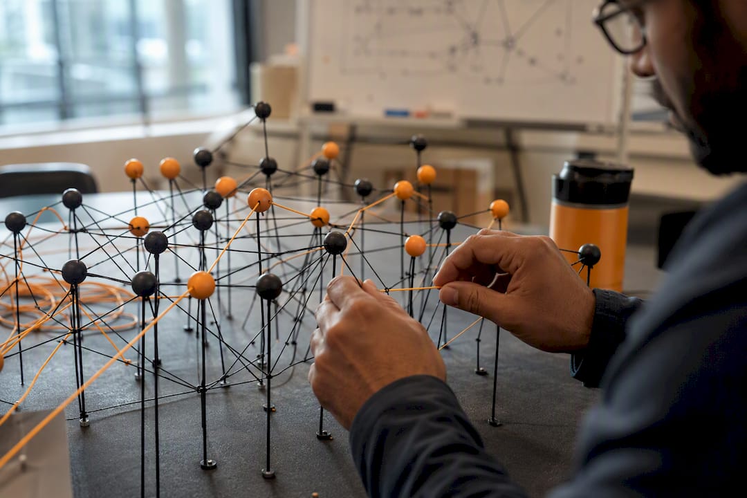 Close-up of hands with neural network model
