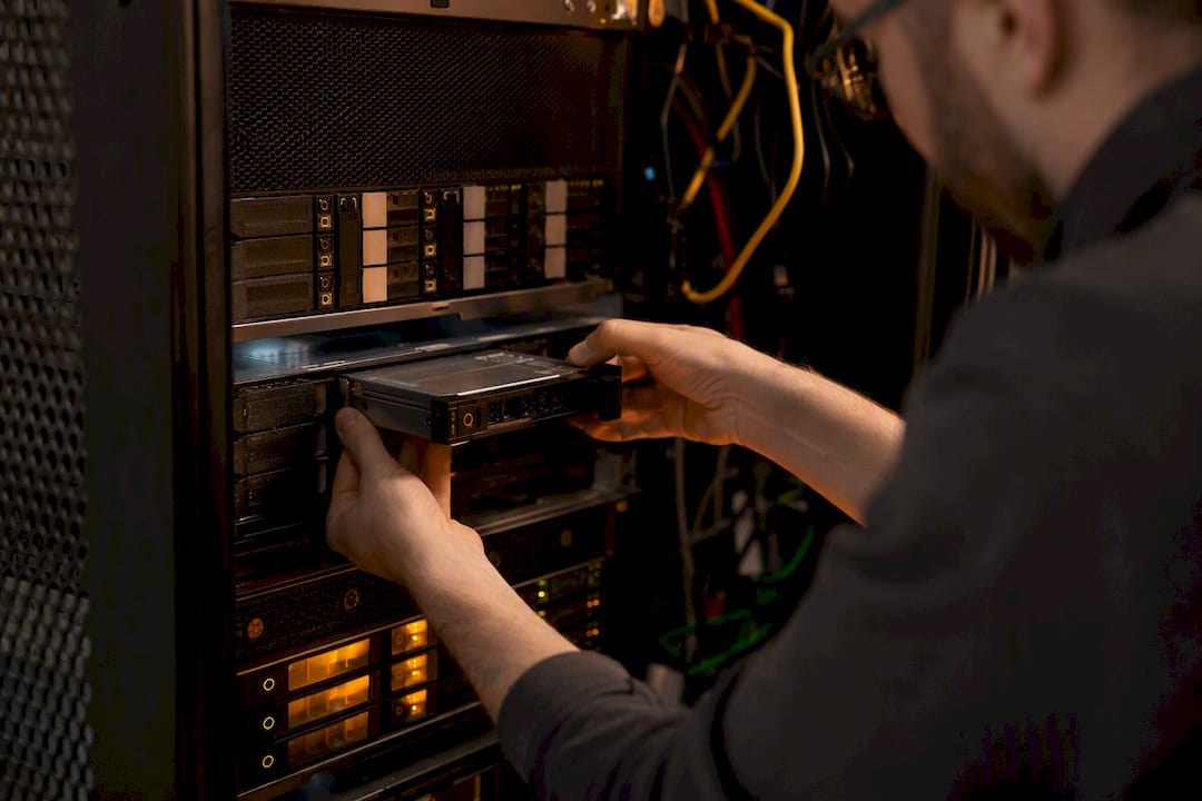 Technician hands installing storage hardware