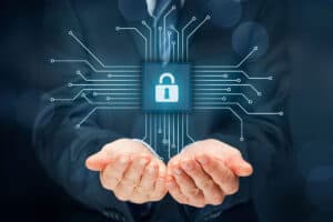 Hands holding digital padlock with circuit connections