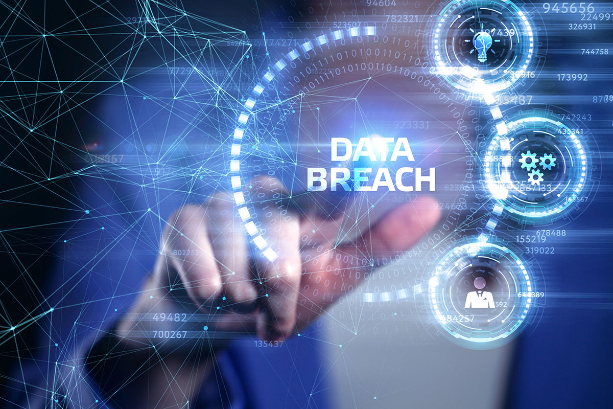 Businessman using digital interface displaying data breach warning