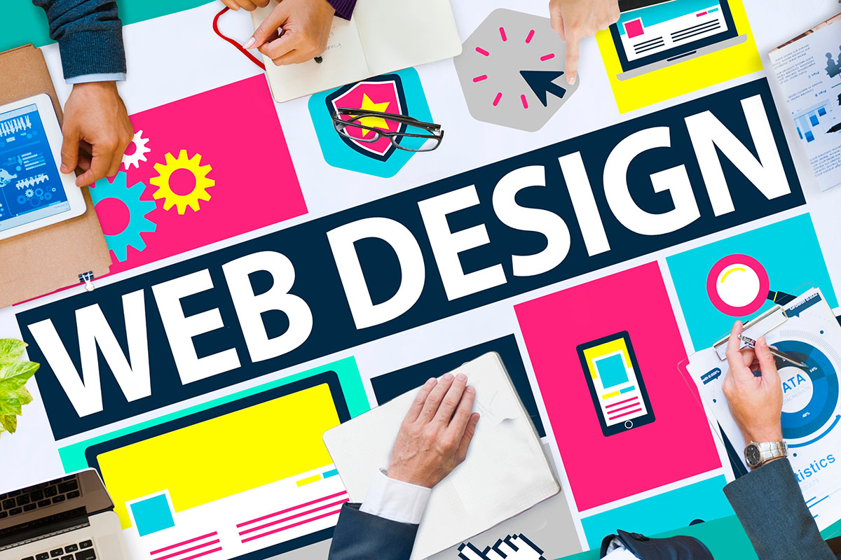 Team creating colorful web design layout around bold title